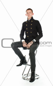 Man sitting on the chair against a white background