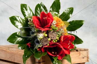 bouquet of flowers with roses in wooden box