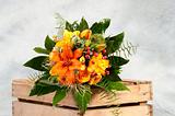 bouquet of flowers with roses in wooden box