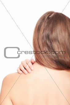 Woman massaging pain in her back, isolated on white background.