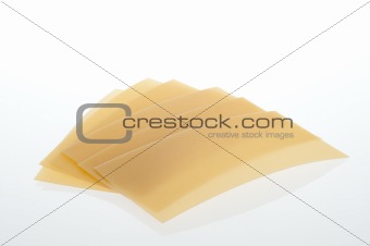 raw lasagne plates on a white background