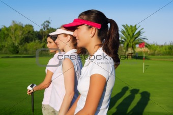 Golf three woman in a row green grass course
