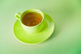The cup of green tea with lemon