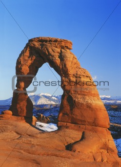 Delicate Arch and the distant La Sal Mountains