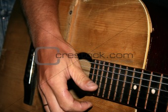Guitar and hand.