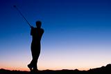 Playing golf at dawn