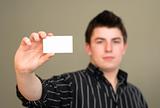Serious Young Man with Business Card