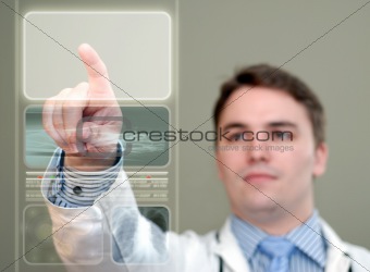 Young Doctor Pressing Glowing Button on Translucent Medical Disp