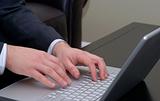 Business Hands with Silver Laptop