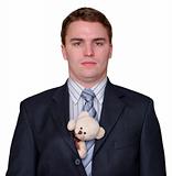 Serious Young Businessman with Teddy Bear in Suit