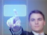 Businessman Pushing Glowing, Blue Button on Translucent Screen.