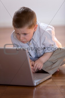 Child with computer at home