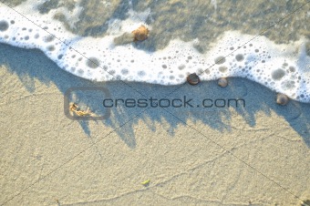 Drawing water on a beach