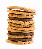 high stack of different types of cookies ; isolated on white background; 