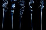 five different separate wisps of smoke on black;
