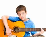 caucasian boy learning to play acoustic guitar; isolated on white background; horizontal crop