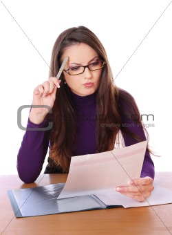 pretty woman is reading document and thinking
