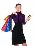 woman with bags and credit card is happy with shopping