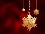 golden Christmas snowflakes over red background