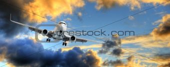 Panorama of airplane in sunset sky