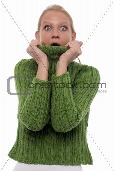 portrait of a scared young caucasian woman with green turtleneck