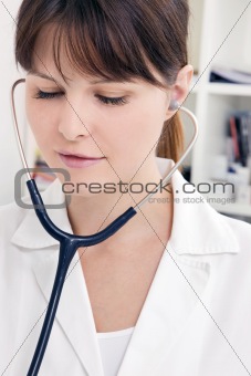 portrait of a young caucasian woman doctor with stethoscope