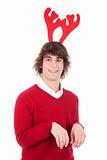 happy young man wearing reindeer horns, on white, studio shot