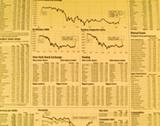Stock Market Newspaper Background with Charts Goldtone and Blurred