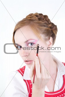 Girl with cosmetics brush