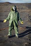 Man in chemical protective suit in desert