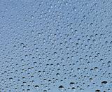 Small drops of water on glass surface