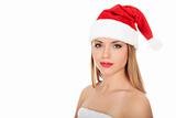 	Beautiful young woman in red wearing santa hat. 