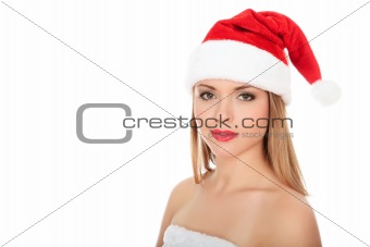 	Beautiful young woman in red wearing santa hat. 