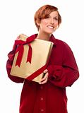 Pretty Red Haired Girl with Wrapped Gift Isolated on a White Background.