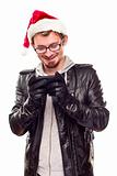 Smiling Young Man with Santa Hat Using Cell Phone Isolated on a White Background.