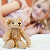 Beautiful young girl with toy