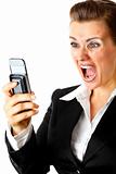 Angry modern business woman shouting on mobile phone
