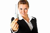  Smiling modern business woman holding  lamp in hand
