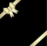 Golden gift ribbon and bow isolated on black