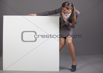 surprised woman with blank board