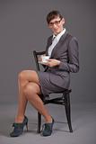 Business woman with cup coffee