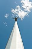 Spinning Windmill with Blue Sky and Clouds Shot From Below