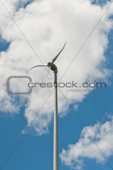 Spinning Windmill with Blue Sky and Clouds