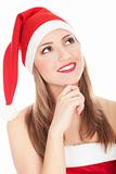 Beautiful young woman in red wearing santa hat.