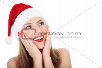 	Beautiful young woman in red wearing santa hat.