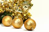 Gold Christmas balls on white background.