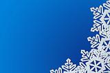 Blue Background with Snowflakes in Border. Space for Text