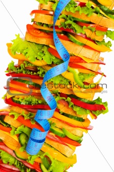 Concept of healthy food with tape measure and sandwich 