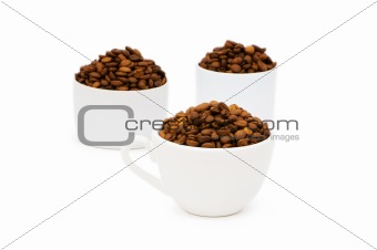 Cup and coffee beans isolated on the white