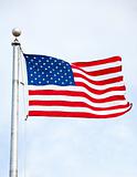 United States Flag Waving In Wind On Flag Pole